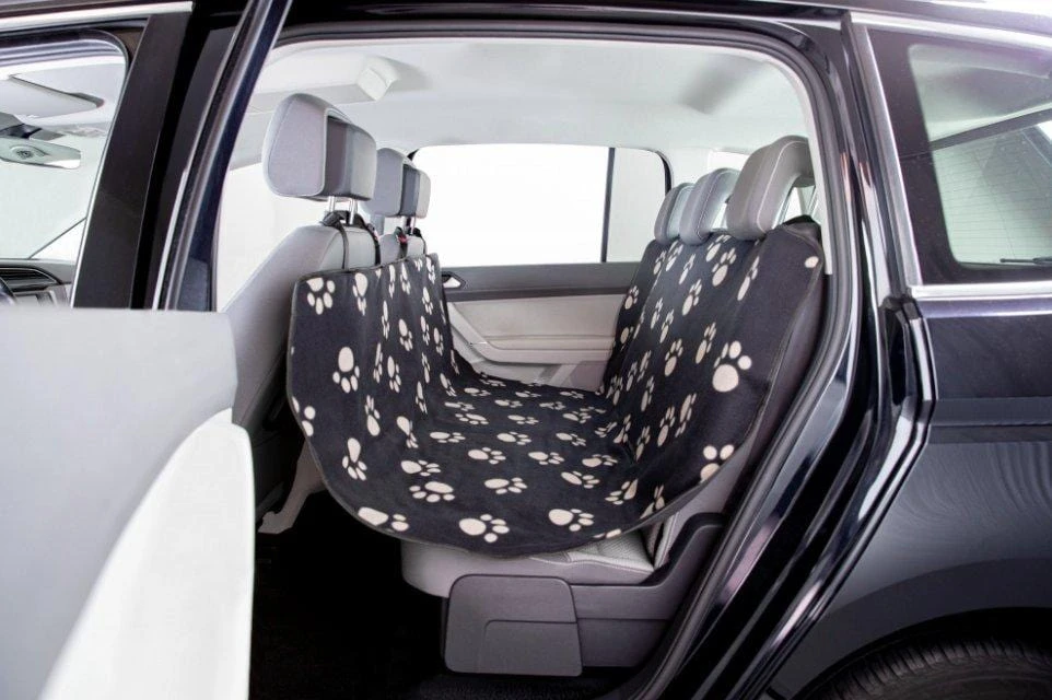 Coprisedile auto cane Trixie nero beige sui sedili posteriori con fantasia zampette